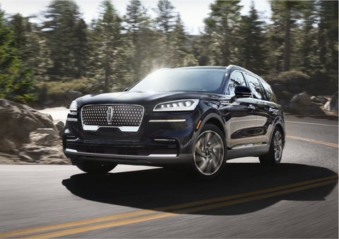 A Lincoln Aviator® SUV is being driven on a winding mountain road | Pilson Lincoln in Mattoon IL