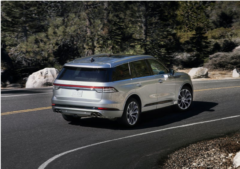 A Lincoln Aviator® is being driven on a winding road | Pilson Lincoln in Mattoon IL
