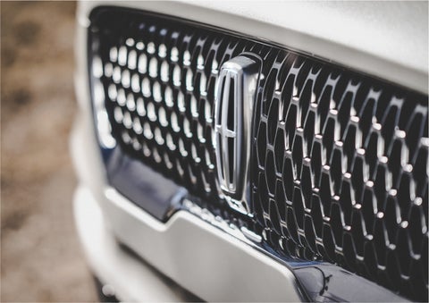 The grille of the 2023 Lincoln Aviator® Reserve model with an eye-catching repeated field of Lincoln Star logo shapes | Pilson Lincoln in Mattoon IL