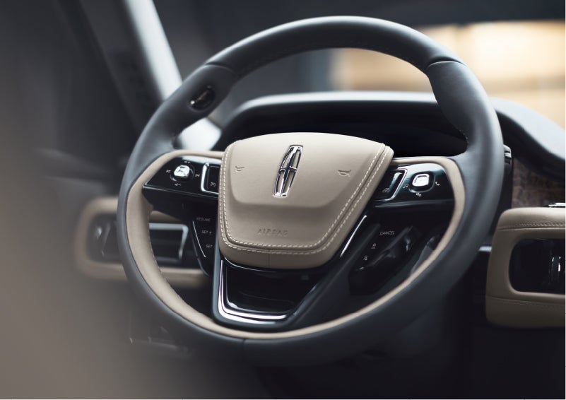 The intuitively placed controls of the steering wheel on a 2023 Lincoln Aviator® SUV | Pilson Lincoln in Mattoon IL